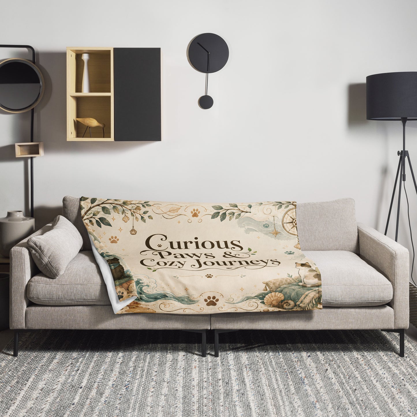 Curious Paws & Cozy Journeys throw blanket styled on a sofa in a living room