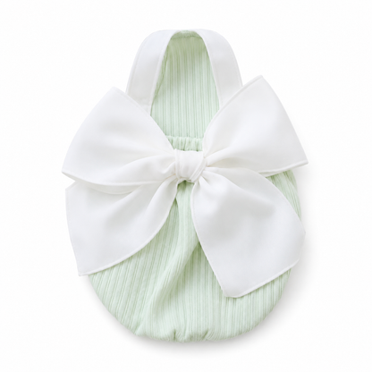 Green bow detail pet dress with a white bow on a white background