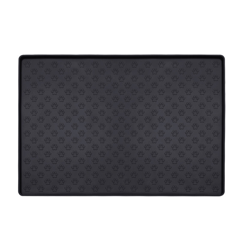 Black paw texture pet feeding mat with raised edge on a white background