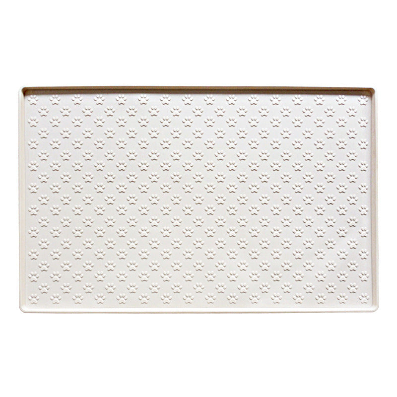 Cream paw texture pet feeding mat with raised edge on a white background