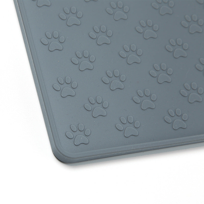 Close-up of the raised paw texture on a gray pet feeding mat