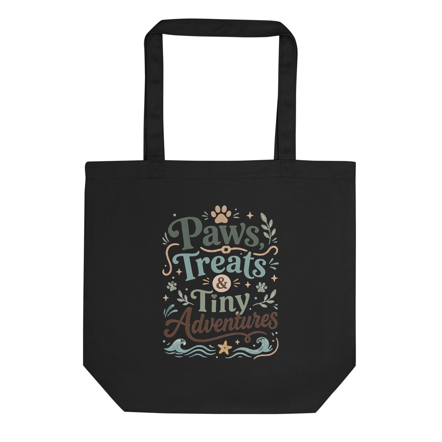 Black organic cotton tote bag with Paws, Treats & Tiny Adventures pet parent artwork.