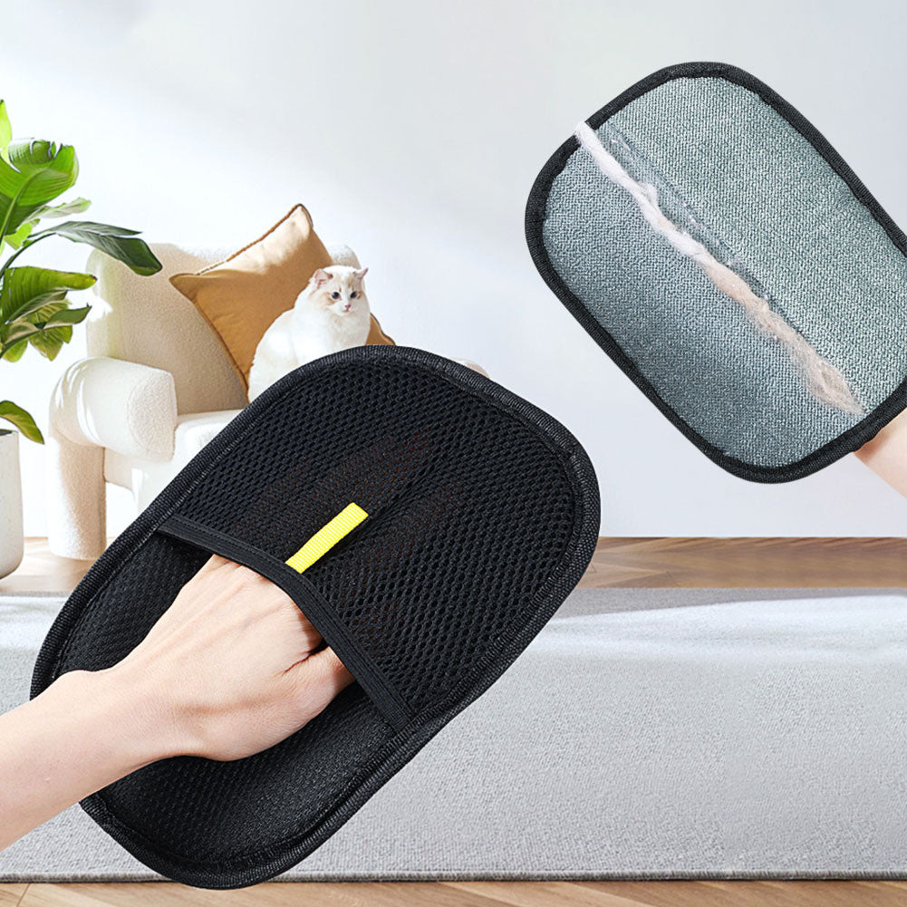 Black pet grooming mitt shown with a dog and cat in a home setting.