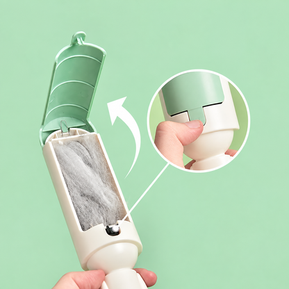 Green pet hair remover roller with cleaning compartment open