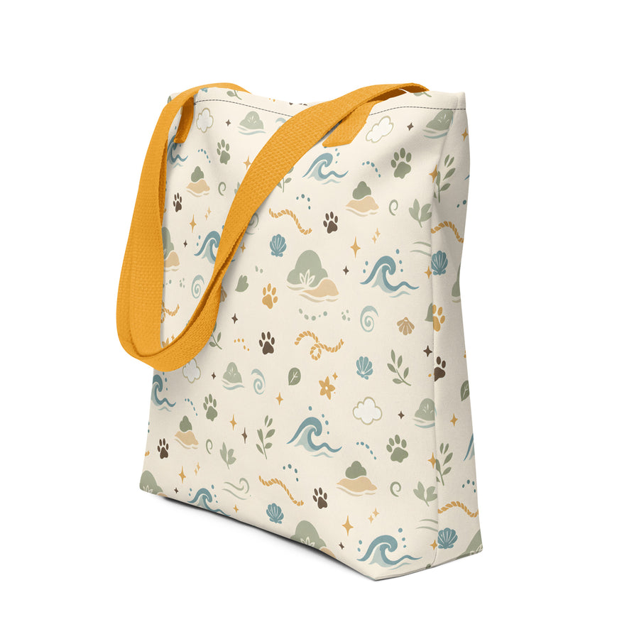 All-over print tote bag with Sea Breeze Paw Trail pet pattern and mustard handles.